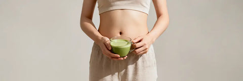 Person holding a cup of matcha tea, representing matcha benefits