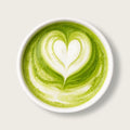 A top-down view of a white ceramic cup filled with a green matcha latte featuring a heart-shaped latte art design on a light beige background.